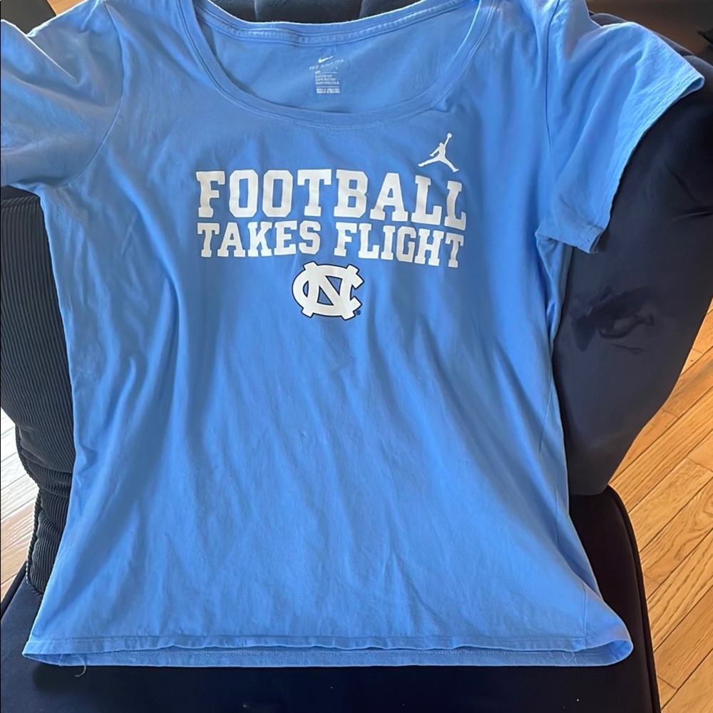 Carolina Blue NC “Football Takes Flight”  T-Shirt